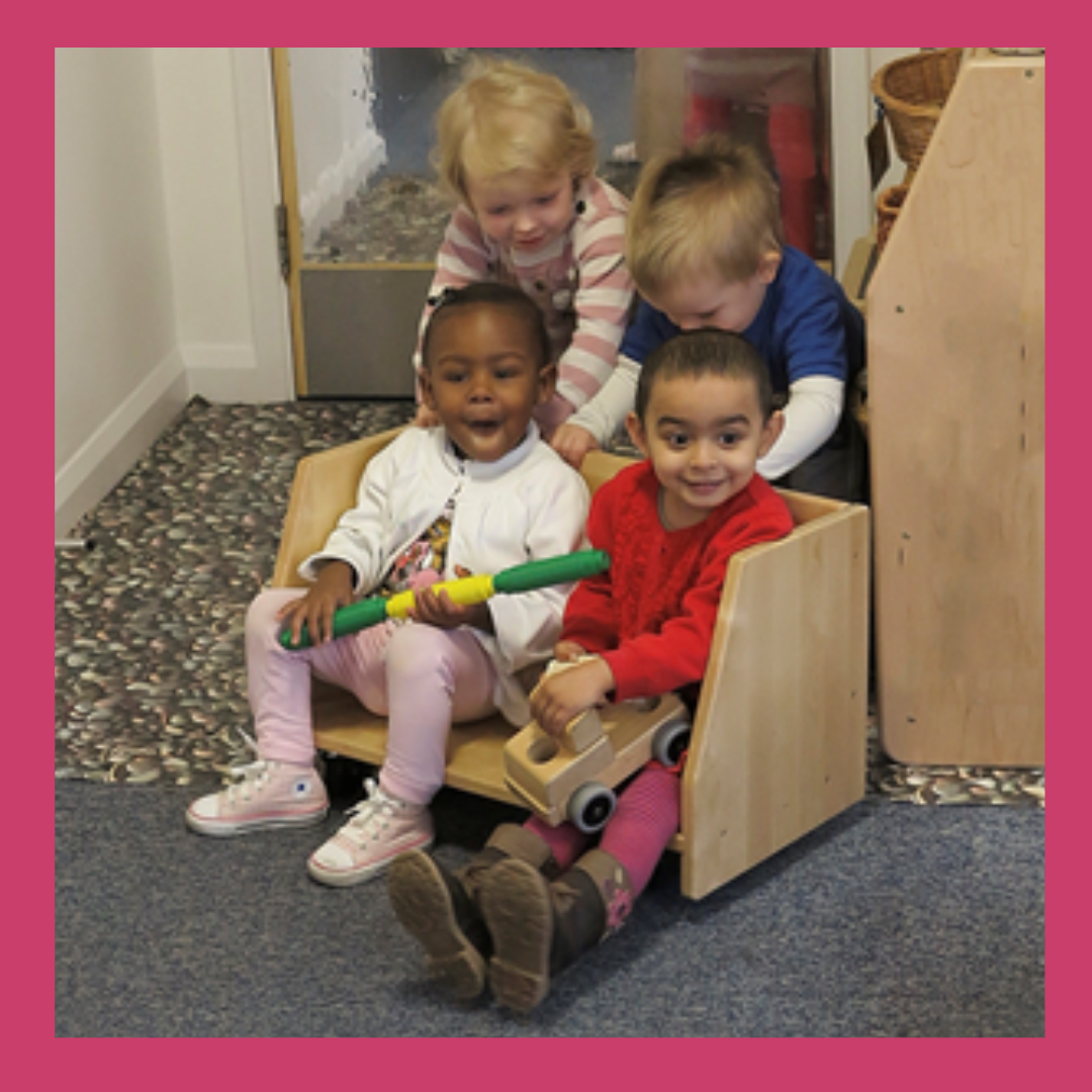 Group of early years children playing together